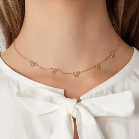 Strikjes ketting Goud